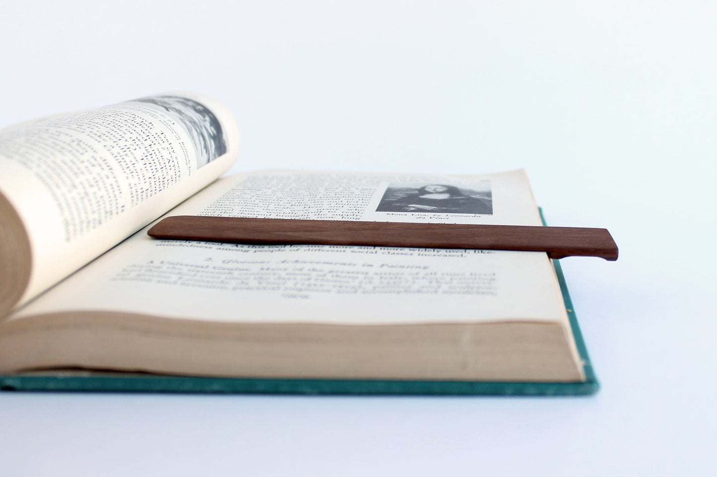 View of Edge Bookmark in book from side to see how edge of bookmark slides along page.