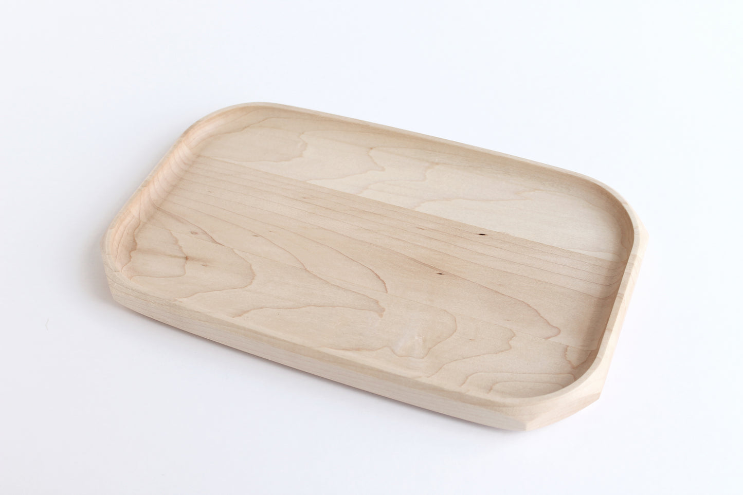 Genesis Tray in Maple wood on white background. Angled view