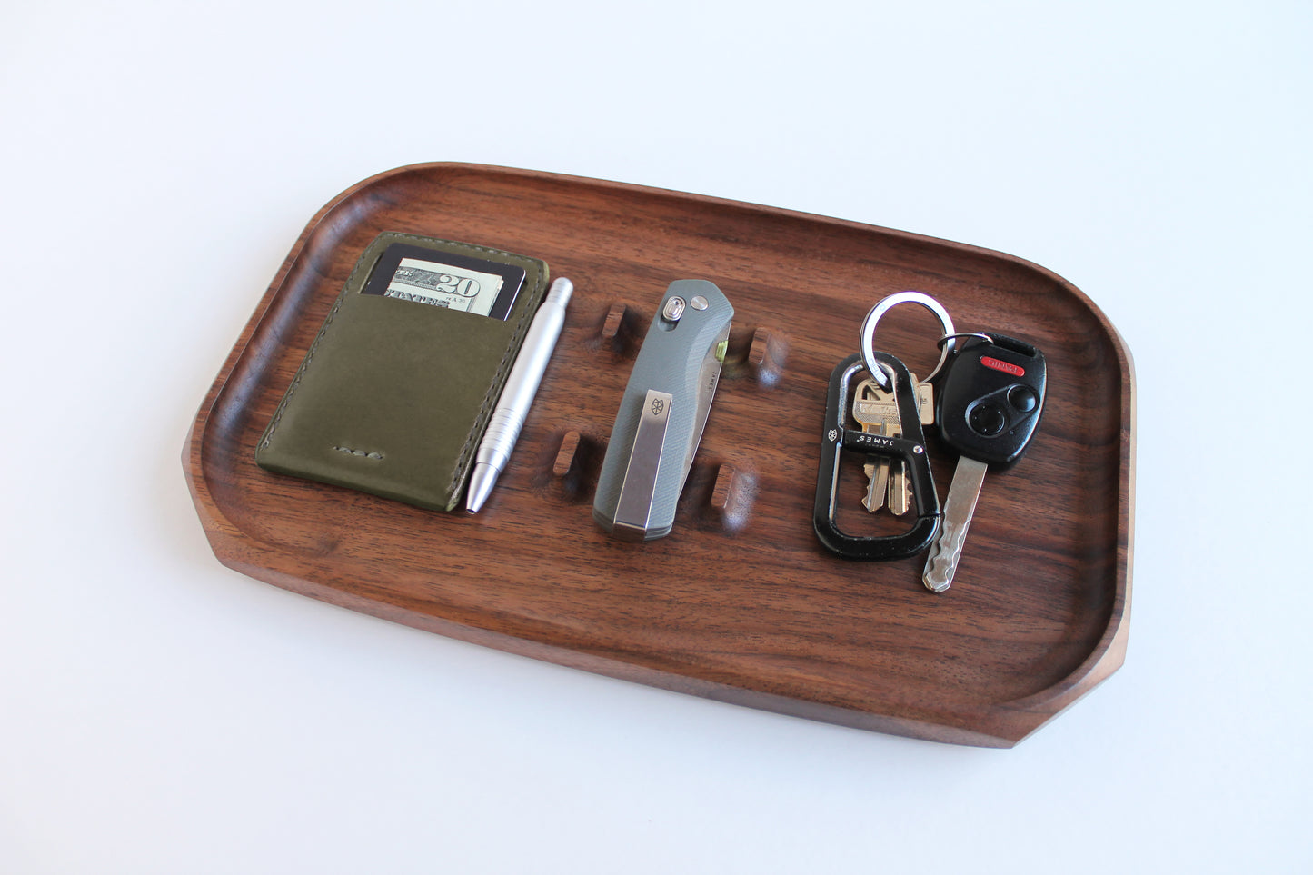 EDC Park Tray in Walnut tray with center ramps for everyday carry items. Angled View with wallet, pocket knife and keys shown.