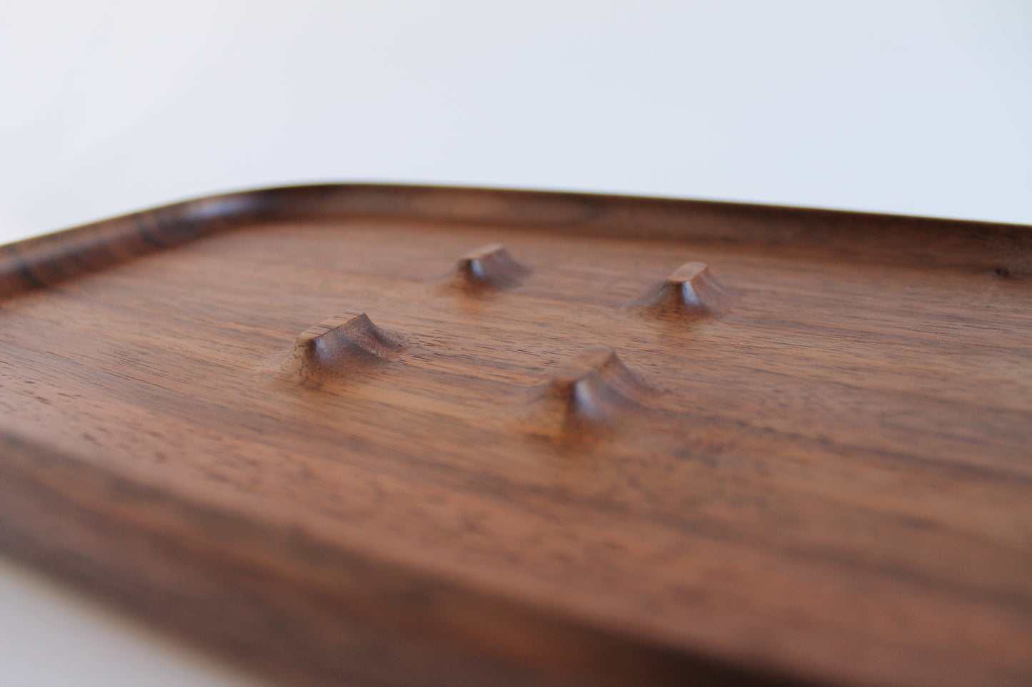EDC Park Tray in Walnut tray with center ramps for everyday carry items. Detail view of center ramps