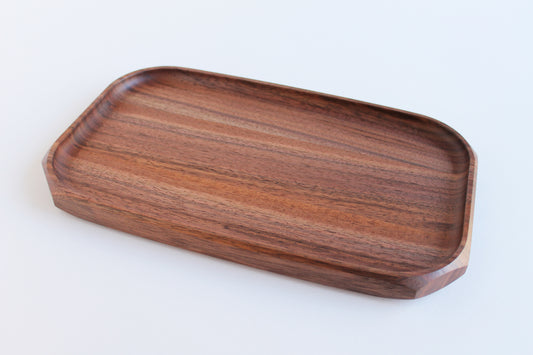 Genesis Tray in Walnut wood on white background. Angled view