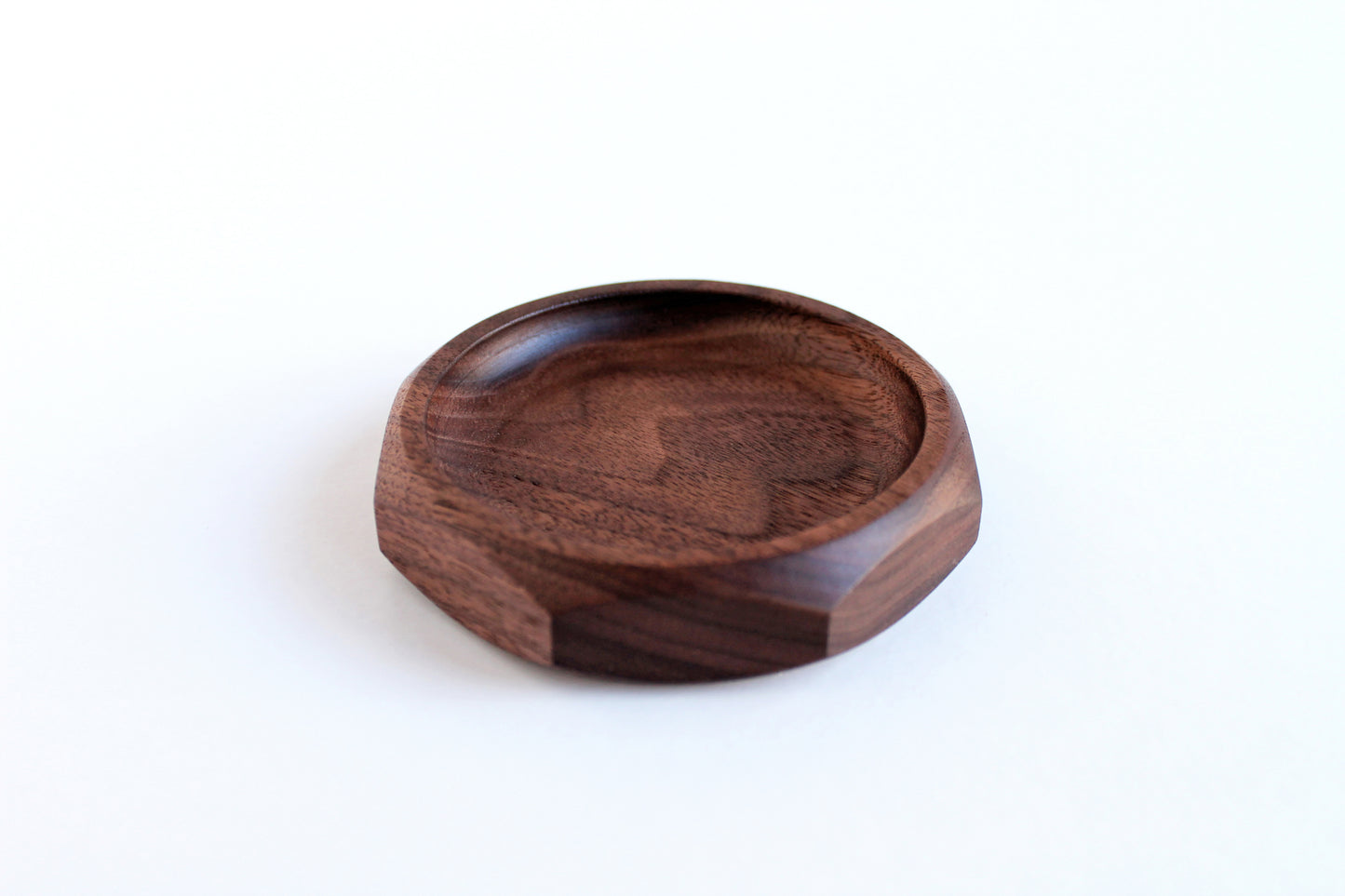 Genesis Dish in Walnut on white background. Angled View.