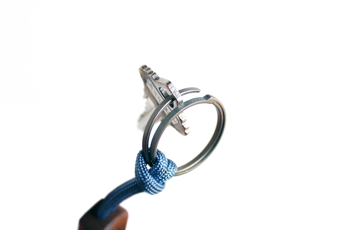 Core Key Fob with Titanium Key Ring, Paracord Lanyard and Walnut or Maple Fob. Detailed view of how titanium key ring can be pushed to side to add or remove keys.
