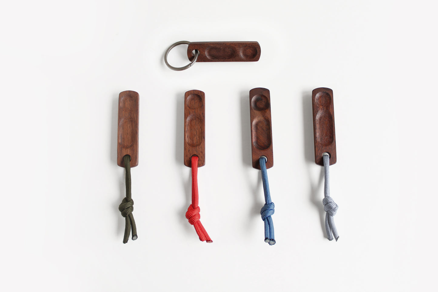 Thumbhill in Walnut shown in five versions: Titanium key ring or lanyard colors Olive, Red, Steel Blue and Silver.
