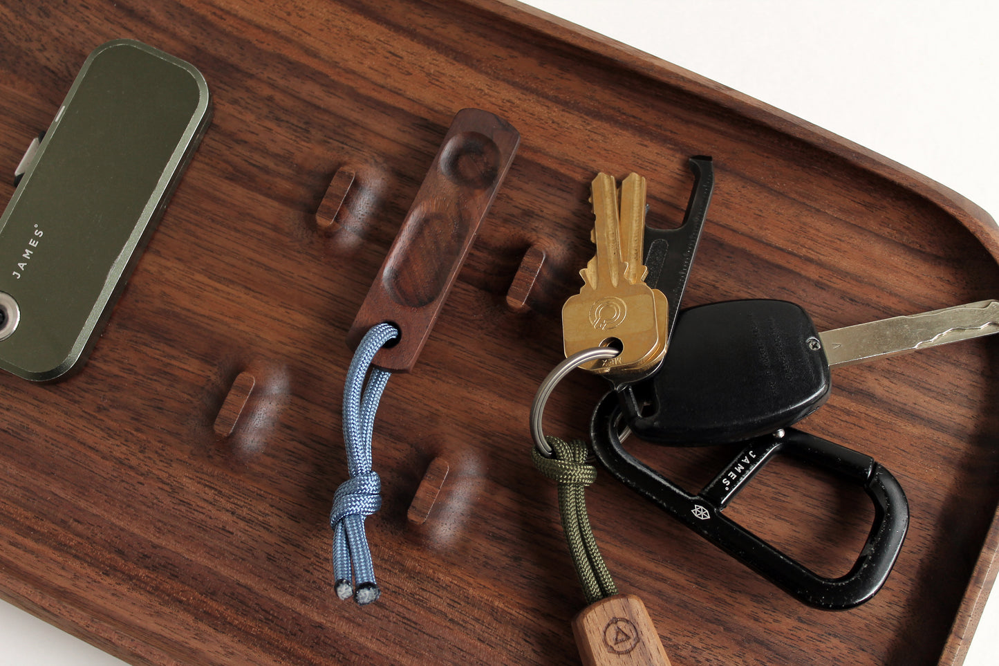 Thumbhill shown in Walnut with steel blue lanyard on EDC Park Tray with box cutter and keys.