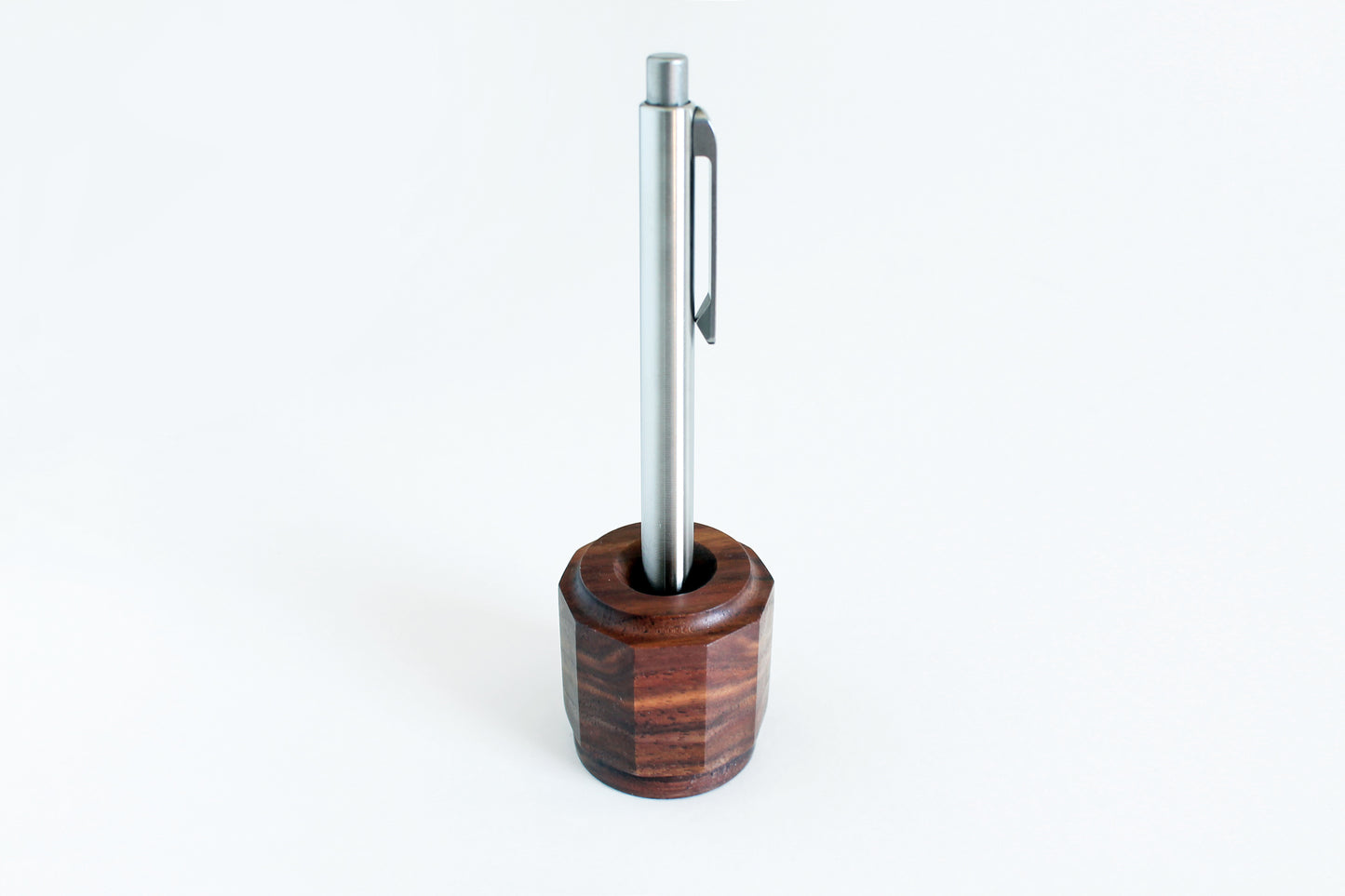 Walnut pen holder with titanium pen angled view