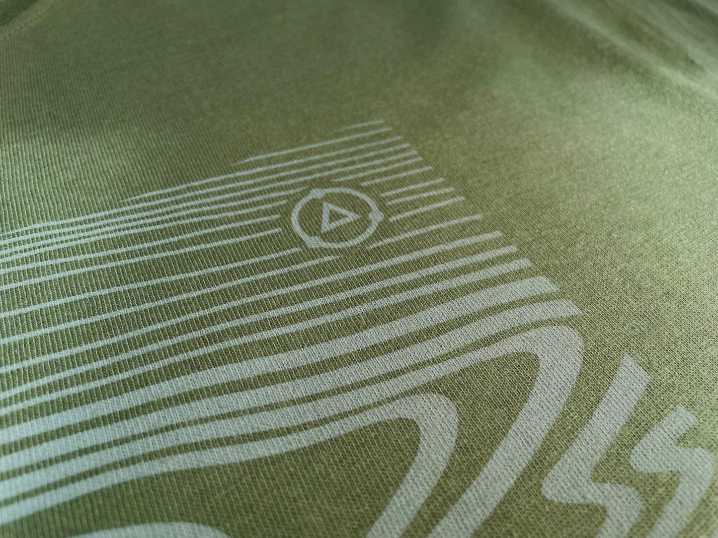 Grain T Shirt macro detailed view of walnut grain graphic printing showing how water based ink embeds into 100% organic cotton fabric.